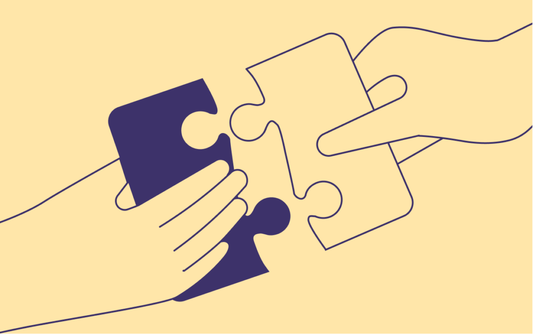 This is a yellow image of two people holding connecting puzzle pieces to symbolize HR and Marketing departments joining together to co-create a memorable employer brand.